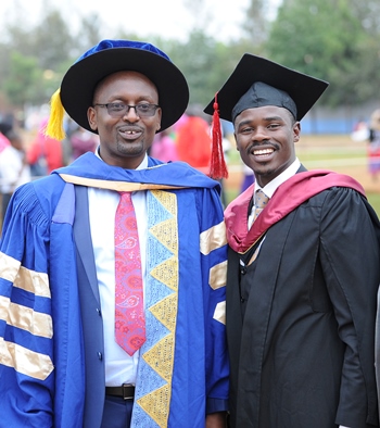 Dr. Christopher Mutembei, Director Centre for Professional Studies{ L} takes a photo with Hon. Paul Mwirigi {R}. Hon. Mwirigi was graduating. 